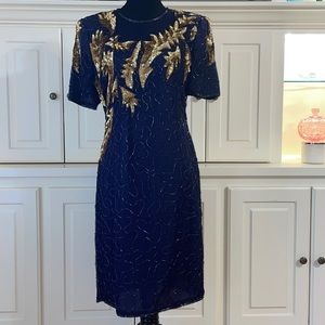 Beautiful vintage navy blue and gold sequined dress. Approximately size 8-10. 😍